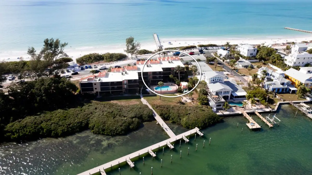A Compass boat tied up at a private vacation rental dock on Anna Maria Island