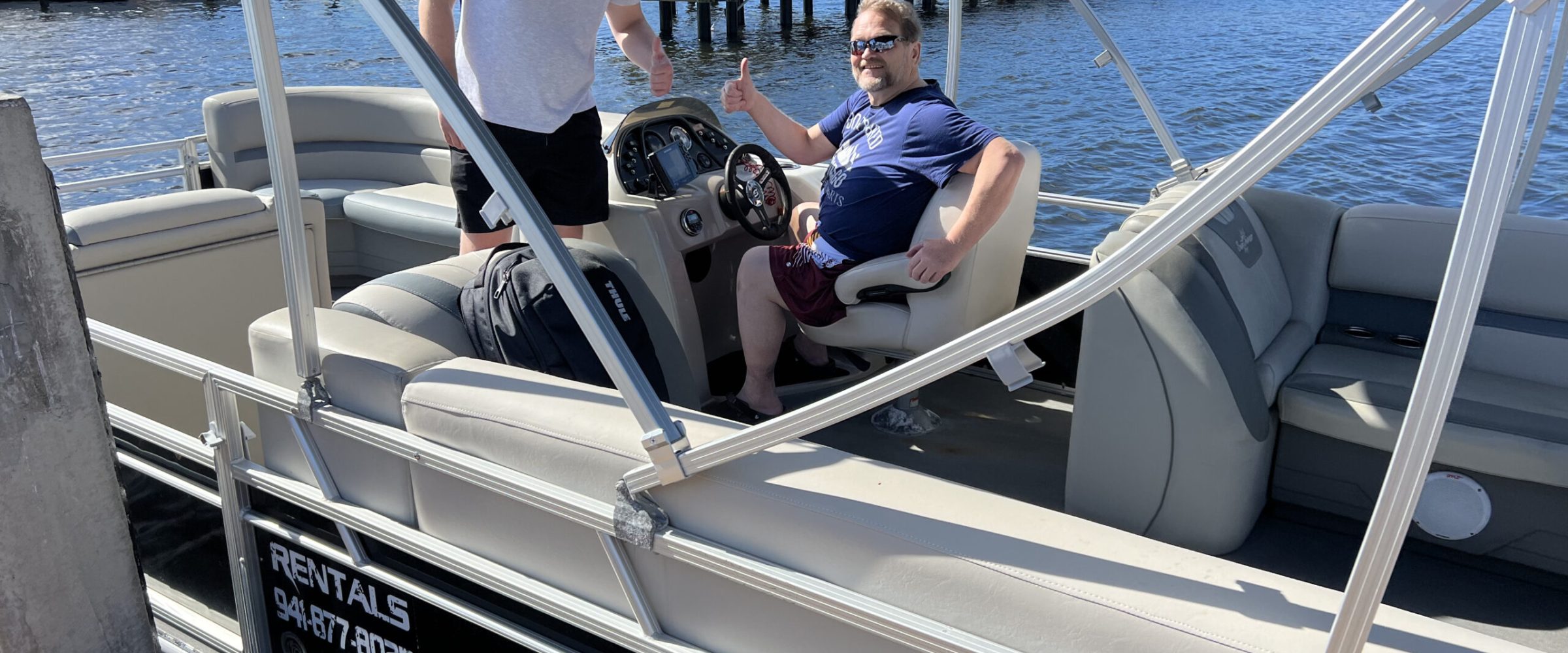a group of people on a deck boat