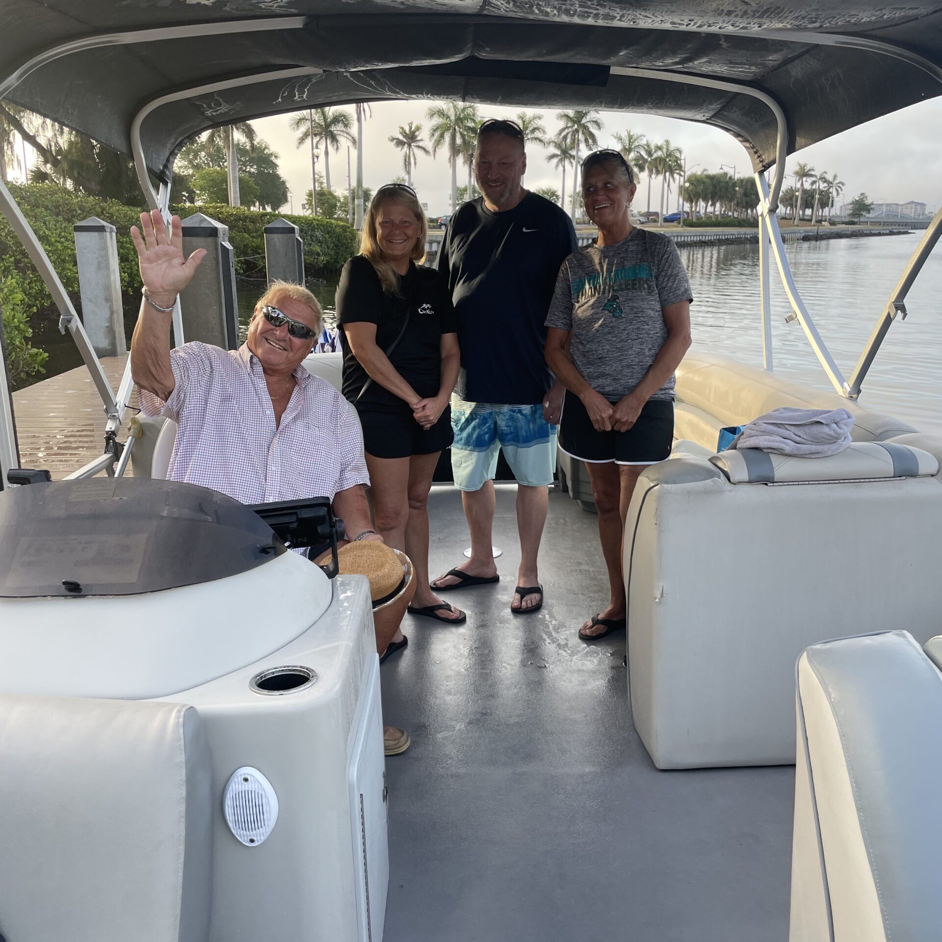 a group of people standing on top of a car