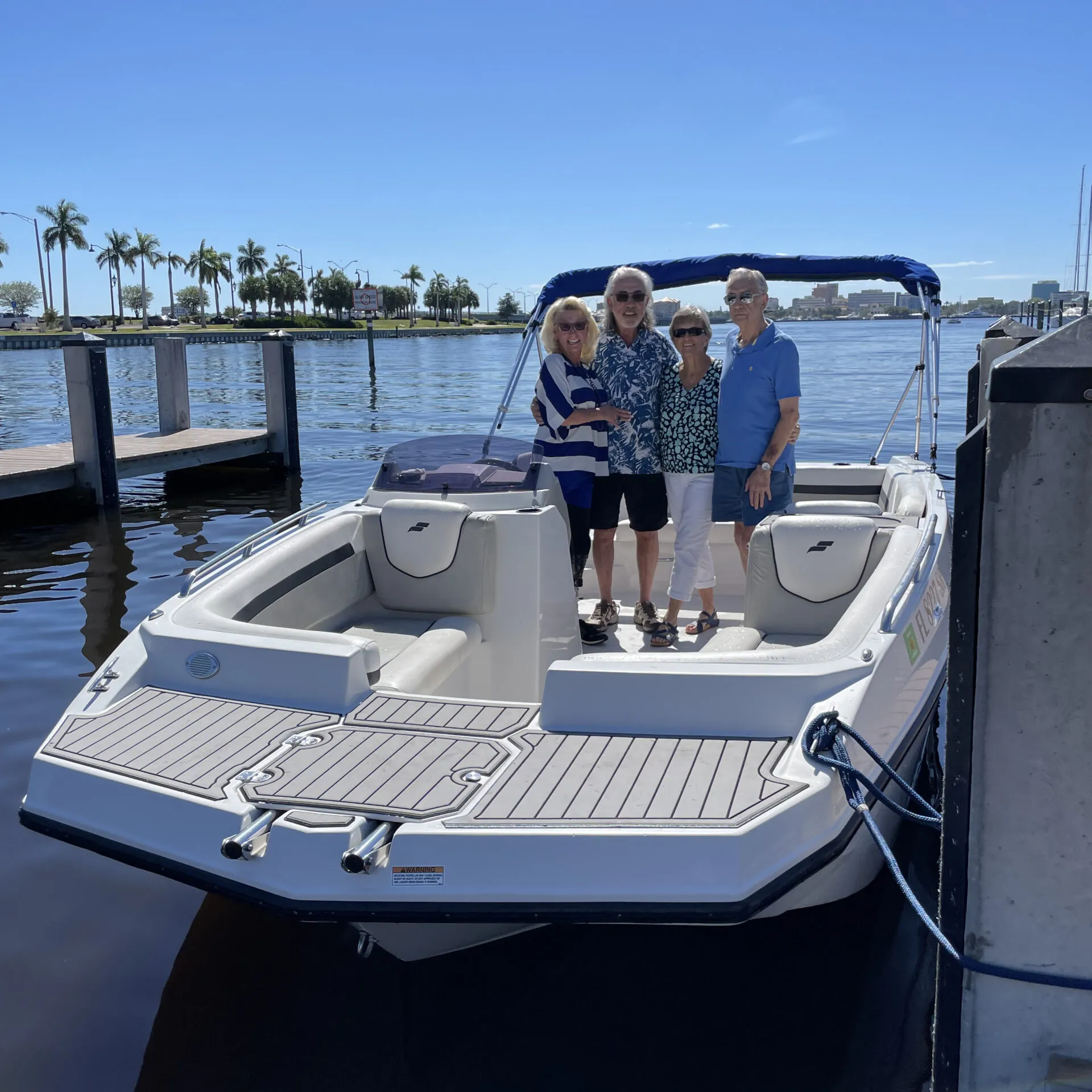 a person standing on a dock next to a body of water