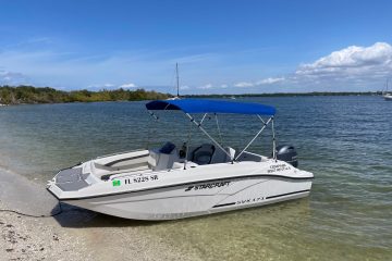 a deck boat on shore