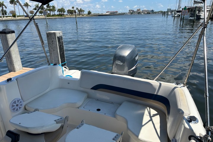 a boat sitting next to a body of water