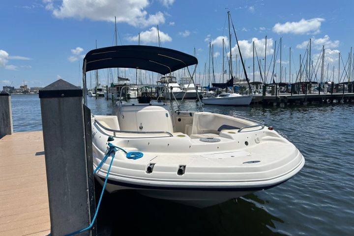 a boat is docked next to a body of water