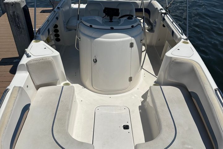 a close up of a boat next to a body of water